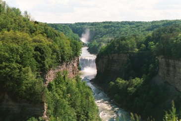 Pictured are the Middle Falls of the Grand Canyon of the East (yes, there is one ... cut by the Genesee River as it runs from Pennsylvania to Ontario.)  The best place for viewing the natural beauty and waterfalls of this Mid Atlantic wonder:  Letchworth State Park ... about 35 miles SW of Rochester, NY.  Used courtesy of the photographer, Andreas Borchert, and the GNU Free Documentation 1.2 License. (http://commons.wikimedia.org/wiki/File:Letchworth_State_Park_Middle_Falls_N_2002.jpeg)